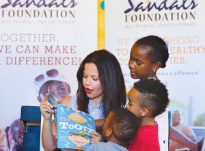 aking time off the beach, Sursok participated in the Sandals Foundation Scholastic Reading Road Trip program.